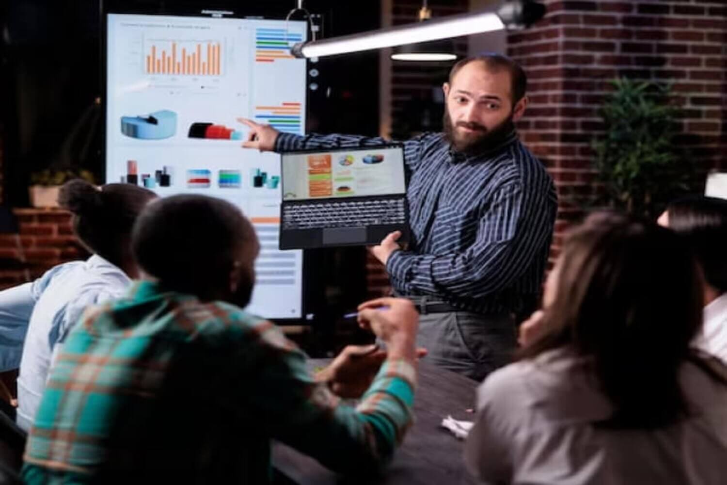 Portrait of adult male working from home at night